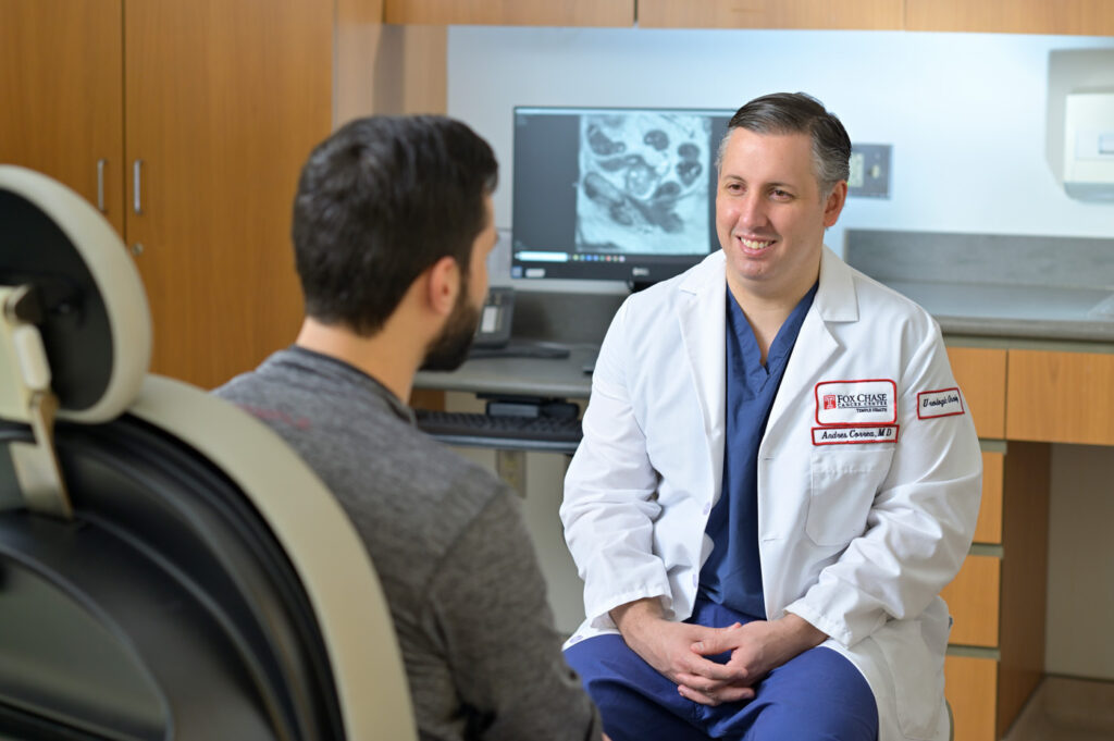 Doctor sitting with patient in office